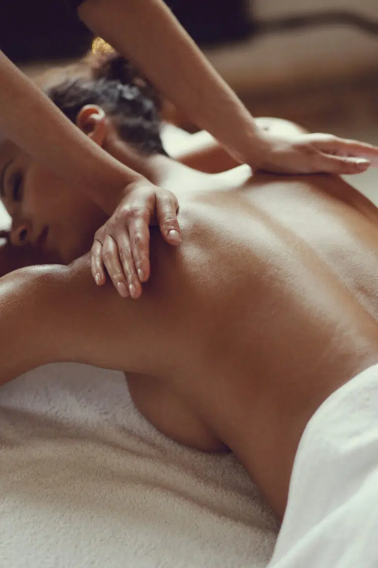 african american woman receiving relaxing massage spa
